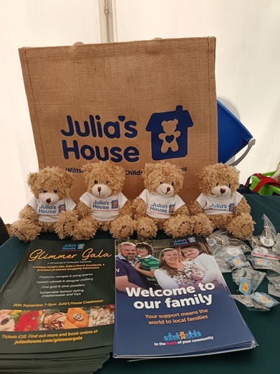 Julia's house info and merch stand with teddies
