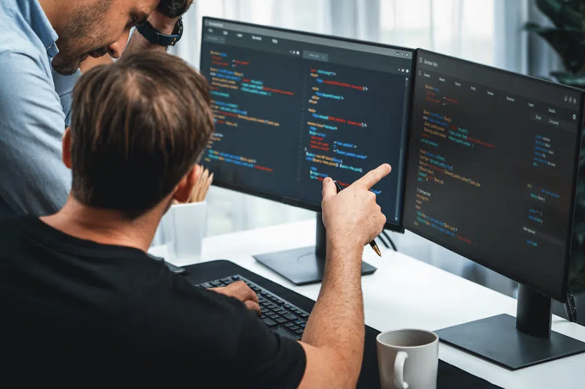Developers discussing code